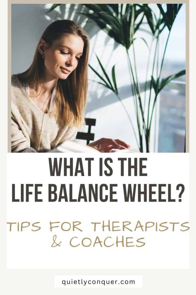 What is The Life Balance Wheel? A Guide for Therapists & Coaches - Image of a woman looking down thoughtfully next to a large window and tall green plant.