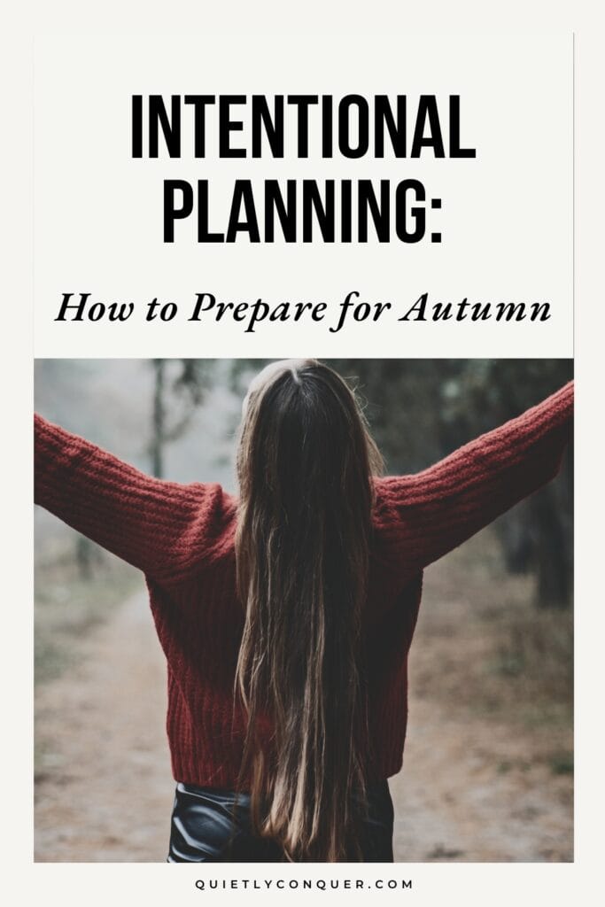 "Intentional Planning: How to Prepare for Autumn" Woman wearing red jumper walking in forest, arms stretched out