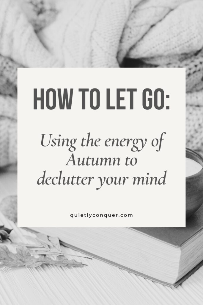 Text: How to Let Go: Using the Energy of Autumn to Declutter Your Mind. Image inbackground of a cosy blanket, with a cup on top of a book. The image is in black & white