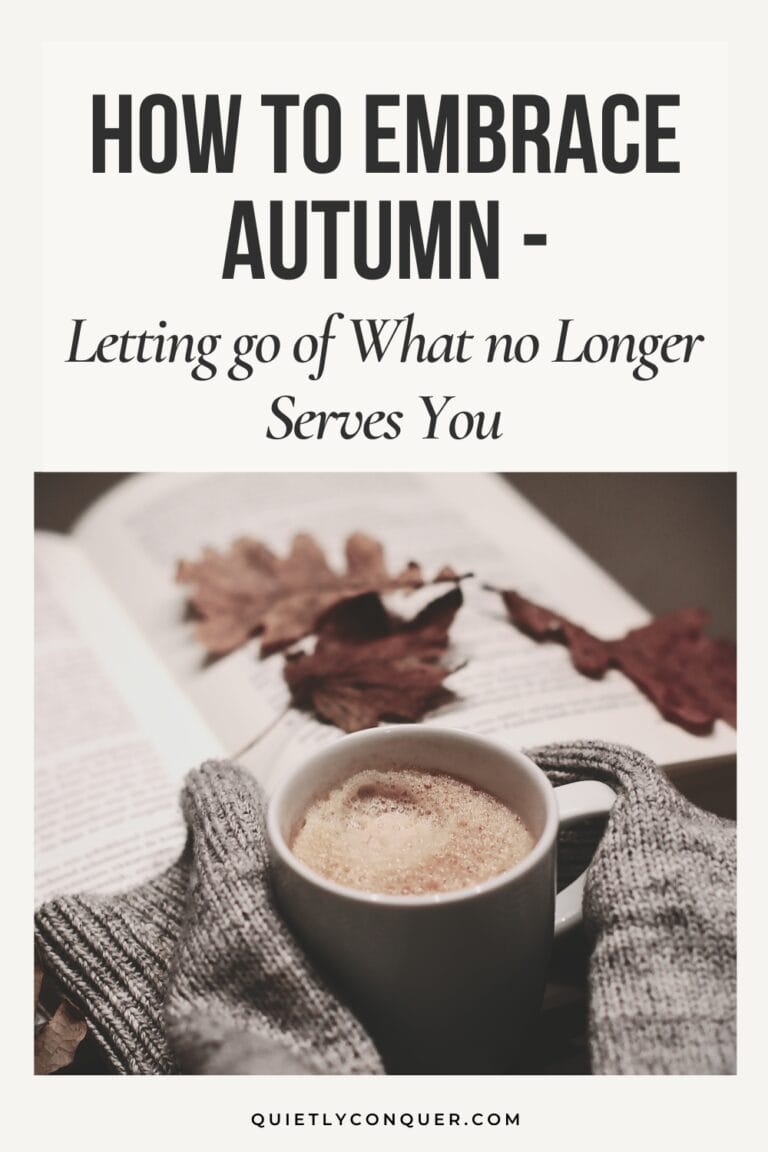 Text reads - How to Embrace Autumn: Letting go of What no Longer Serves You. Image of an open book, autumn leaves and a mug of warm drink.