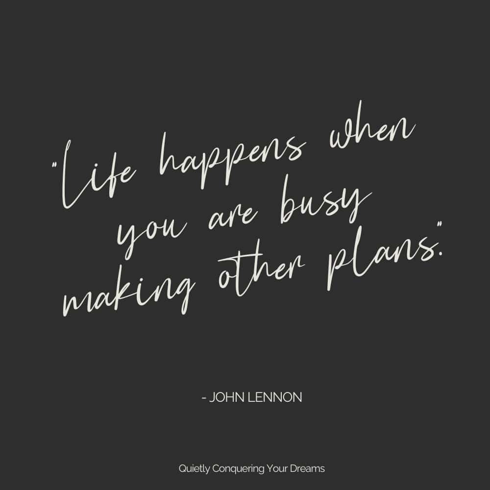 Quote by John Lennon "Life happens when you are busy making plans" on a black background wit white, script font