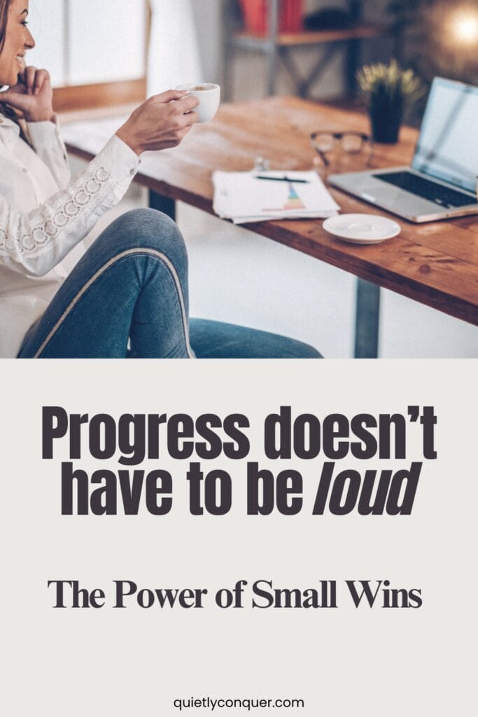 Progress Doesn’t Have to Be Loud: The Power of Small Wins - Image is of a Woman working at her table at home. Paperwork next to open laptop