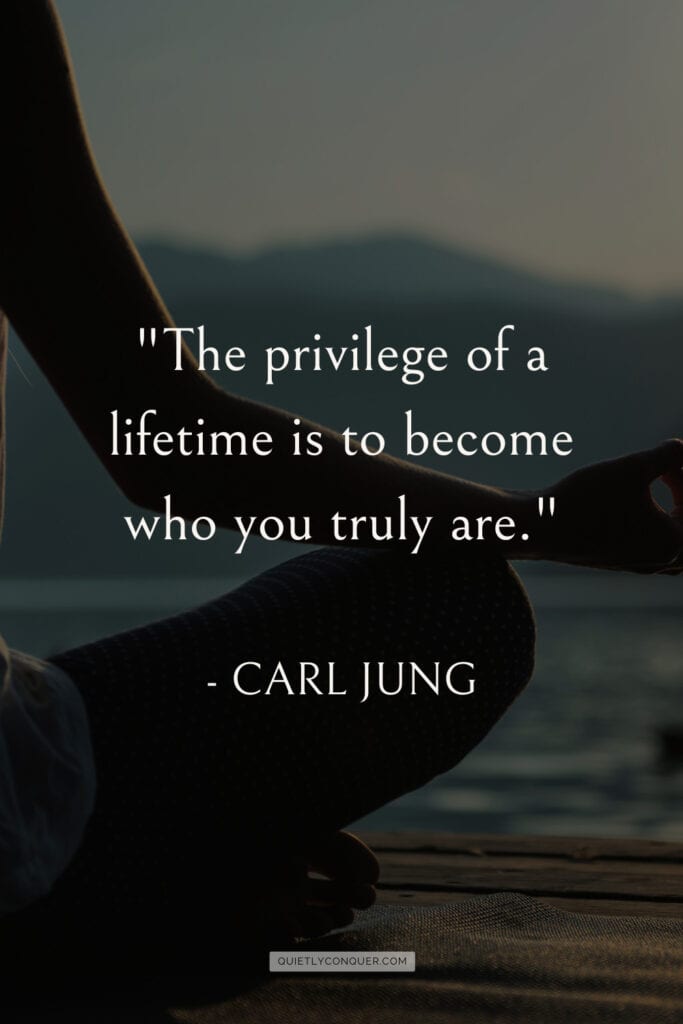 WOmans side of body in yoga pose next to body of water. Text "The privilege of a lifetime is to become who you truly are" Lao Tzu